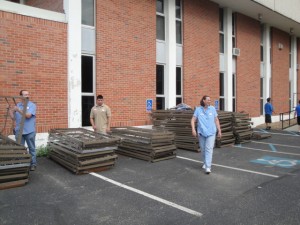Within a week of the Joplin tornado in 2011, UCM rearranged its furniture replacement schedule to send nearly 500 beds and sets of bedding to the relief effort.  UCM’s Brenda Moeder is pictured in front of beds stacked for shipment to Joplin.