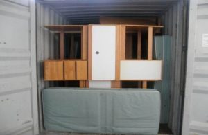 One of three shipping containers with Westfield State University dorm and classroom furnishings, about to be unloaded in Port au Prince.